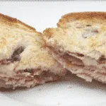 Bacon, brie and cranberry sarnie. What a recipe. A little indulgent I'll give you but once in a while this is a must in our house. Bacon, brie and cranberry jam. What more do you need? Yum Yum!! | https:theyumyumclub.com