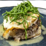 Pan fried cod with classic beurre blanc sauce. This is a fantastic recipe and very versatile with how it can be served. I placed the cod on a potato rosti and topped it with samphire. Seafood with vegetables from the sea. Yum! | https://theyumyumclub.com