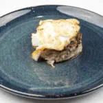 Pan fried cod with classic beurre blanc sauce. This is a fantastic recipe and very versatile with how it can be served. I placed the cod on a potato rosti and topped it with samphire. Seafood with vegetables from the sea. Yum! | https://theyumyumclub.com