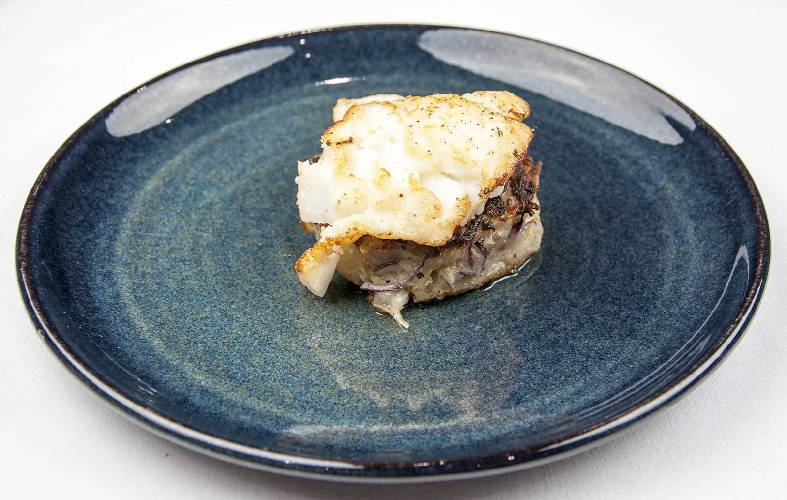 Pan fried cod with classic beurre blanc sauce. This is a fantastic recipe and very versatile with how it can be served. I placed the cod on a potato rosti and topped it with samphire. Seafood with vegetables from the sea. Yum! | https://theyumyumclub.com