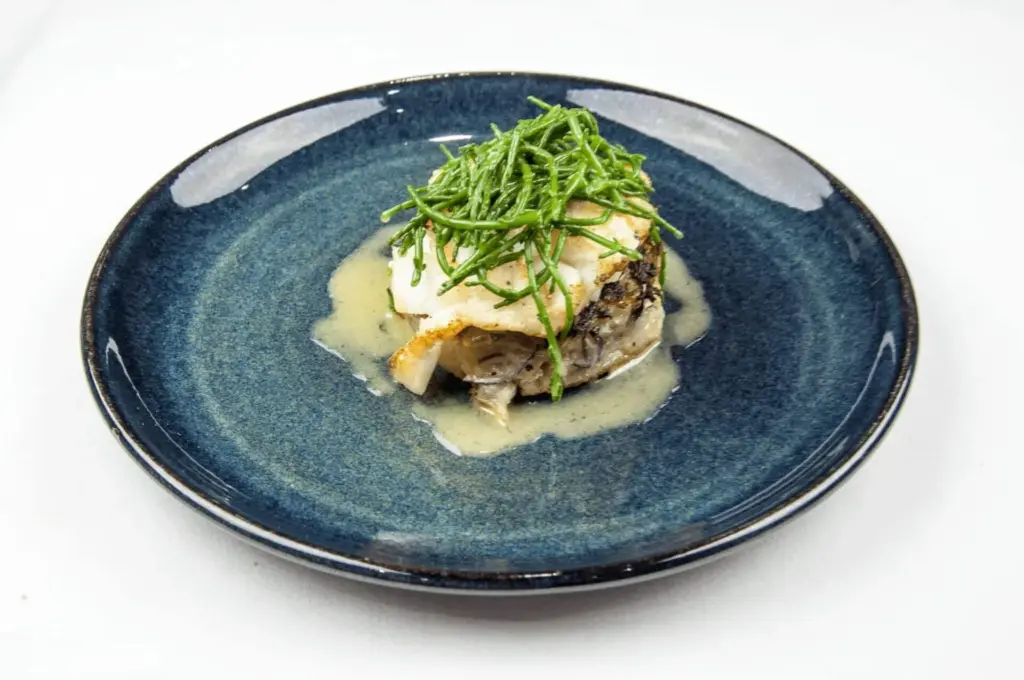 Pan fried cod with classic beurre blanc sauce. This is a fantastic recipe and very versatile with how it can be served. I placed the cod on a potato rosti and topped it with samphire. Seafood with vegetables from the sea. Yum! | https://theyumyumclub.com