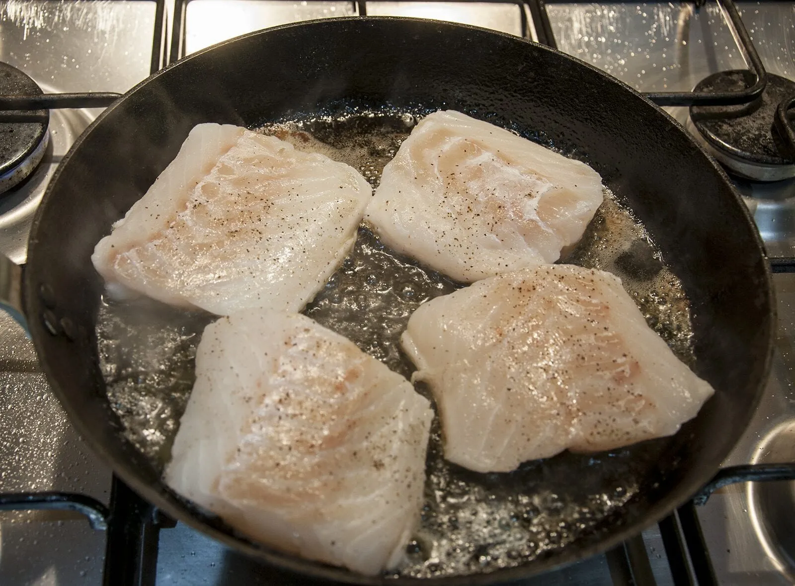 Pan fried cod with classic beurre blanc sauce. This is a fantastic recipe and very versatile with how it can be served. I placed the cod on a potato rosti and topped it with samphire. Seafood with vegetables from the sea. Yum! | https://theyumyumclub.com