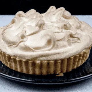 Lemon meringue pie! What a classic. Lovely sweet meringue, zesty sharp lemon, and a melt in the mouth pastry. Yummy! | https://theyumyumclub.com