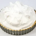 Lemon meringue pie! What a classic. Lovely sweet meringue, zesty sharp lemon, and a melt in the mouth pastry. Yummy! | https://theyumyumclub.com