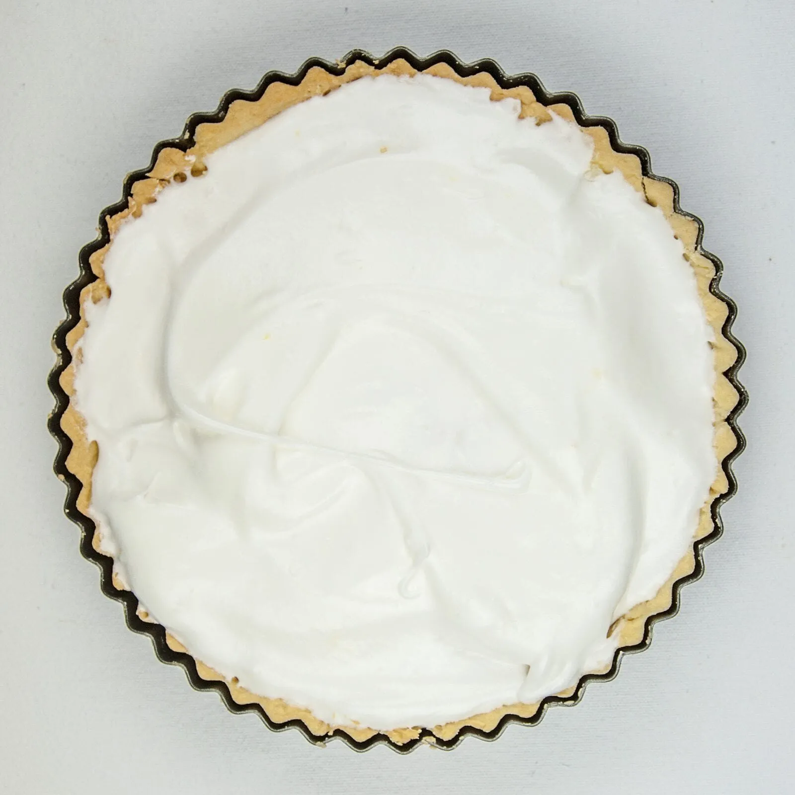 Lemon meringue pie! What a classic. Lovely sweet meringue, zesty sharp lemon, and a melt in the mouth pastry. Yummy! | https://theyumyumclub.com