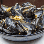 Mussels with white wine, garlic, parsley and cream. A classic moules mariniere recipe. This such a tasty seafood dish and so simple to make. If you ignore the cream it's even healthy ????!! | https://theyumyumclub.com