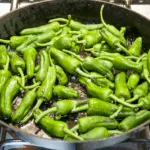 How to cook Pimiento Padron Peppers. The best and only Padron Pepper recipe you will need. 3 ingredients only and 5 minutes of cooking. So simple & so Yum! I just love this vegetarian and vegan recipe!! | https://theyumyumclub.com