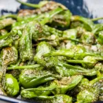 How to cook Pimiento Padron Peppers. The best and only Padron Pepper recipe you will need. 3 ingredients only and 5 minutes of cooking. So simple & so Yum! I just love this vegetarian and vegan recipe!! | https://theyumyumclub.com