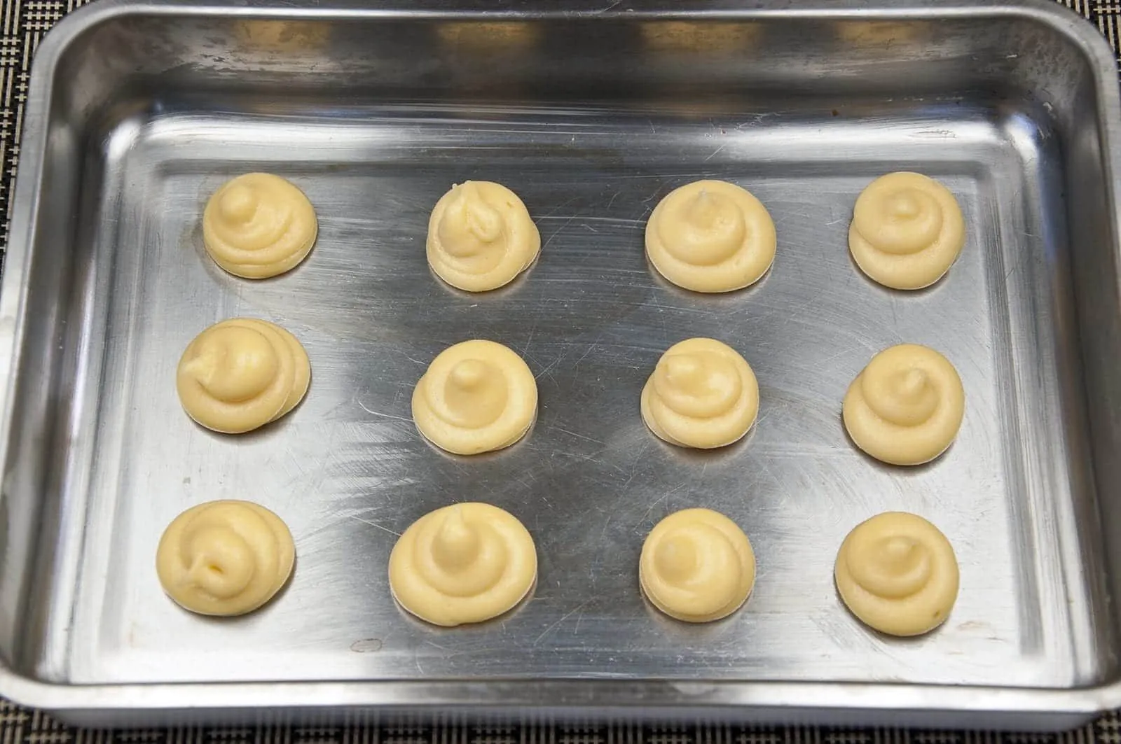 Profiteroles Recipe - How to make the finest profiteroles. Simple and easy. YOU can make them today. Choux buns, cream and chocolate! YUM! | https://theyumyumclub.com