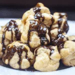 Profiteroles Recipe - How to make the finest profiteroles. Simple and easy. YOU can make them today. Choux buns, cream and chocolate! YUM! | https://theyumyumclub.com