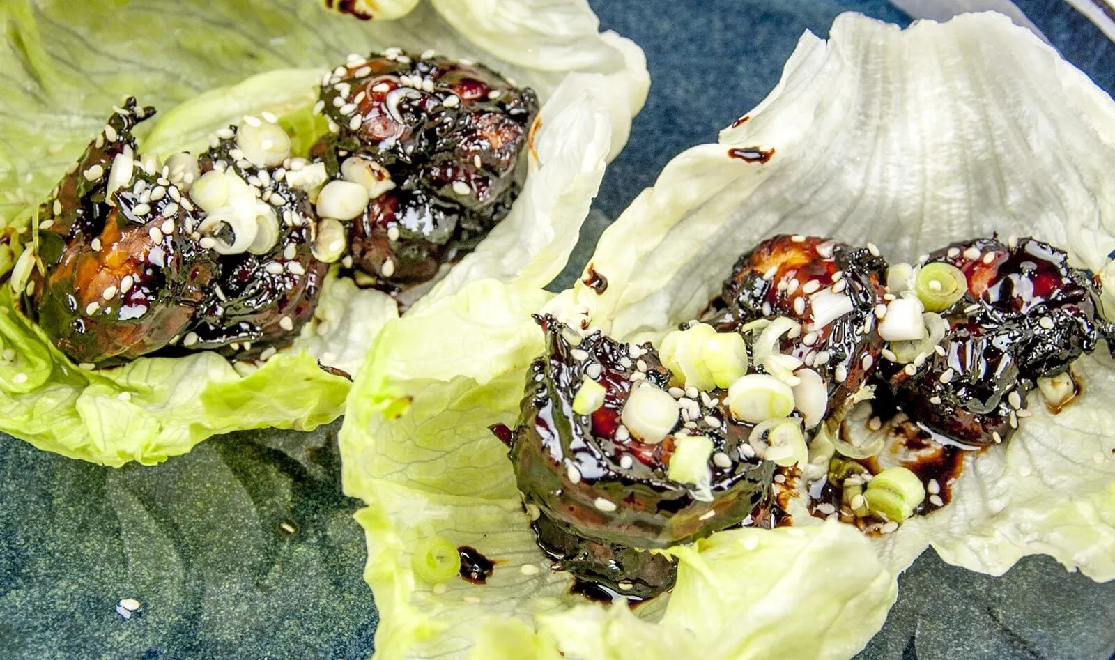 How to make teriyaki tiger prawns. What can be more Japanese? Serve them in a fresh crunchy lettuce wrap and you have one fab healthy, low carb recipe. Yum! | https://theyumyumclub.com