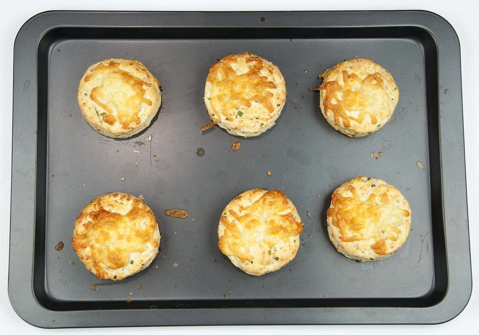 Cheese and chive scones. I love these savoury beauties. Serve with just a good helping of butter, or use as croutons with some wonderful warming soup. Yum! | theyumyumclub.com