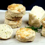 Cheese and chive scones. I love these savoury beauties. Serve with just a good helping of butter, or use as croutons with some wonderful warming soup. Yum! | theyumyumclub.com