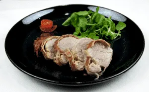 Roasted Pork fillet smothered in Dijon mustard and coated in prosciutto. Tender and juicy pork fillet. This is a wonderfully tasty pork dish. Very easy to make with only 3 ingredients and ready in 30 minutes. Low fat and healthy pork. Yum! | theyumyumclub.com