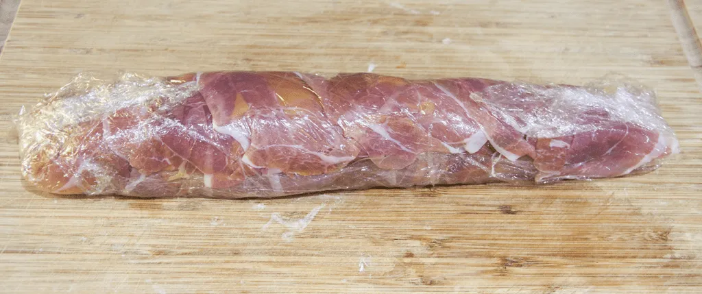 Roasted Pork fillet smothered in Dijon mustard and coated in prosciutto. Tender and juicy pork fillet. This is a wonderfully tasty pork dish. Very easy to make with only 3 ingredients and ready in 30 minutes. Low fat and healthy pork. Yum! | theyumyumclub.com