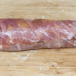 Roasted Pork fillet smothered in Dijon mustard and coated in prosciutto. Tender and juicy pork fillet. This is a wonderfully tasty pork dish. Very easy to make with only 3 ingredients and ready in 30 minutes. Low fat and healthy pork. Yum! | theyumyumclub.com