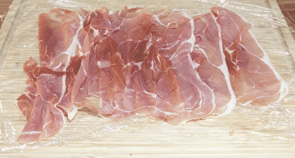 Roasted Pork fillet smothered in Dijon mustard and coated in prosciutto. Tender and juicy pork fillet. This is a wonderfully tasty pork dish. Very easy to make with only 3 ingredients and ready in 30 minutes. Low fat and healthy pork. Yum! | theyumyumclub.com