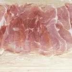 Roasted Pork fillet smothered in Dijon mustard and coated in prosciutto. Tender and juicy pork fillet. This is a wonderfully tasty pork dish. Very easy to make with only 3 ingredients and ready in 30 minutes. Low fat and healthy pork. Yum! | theyumyumclub.com