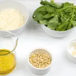 How to make pesto at home. The fresh taste of Italy. Just 5 ingredients in this wonderful vegetarian recipe. Basil, garlic, pine nuts, olive oil and parmesan cheese. Fantastic for pasta. Yum! | theyumyumclub.com