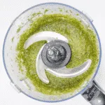 How to make pesto at home. The fresh taste of Italy. Just 5 ingredients in this wonderful vegetarian recipe. Basil, garlic, pine nuts, olive oil and parmesan cheese. Fantastic for pasta. Yum! | theyumyumclub.com