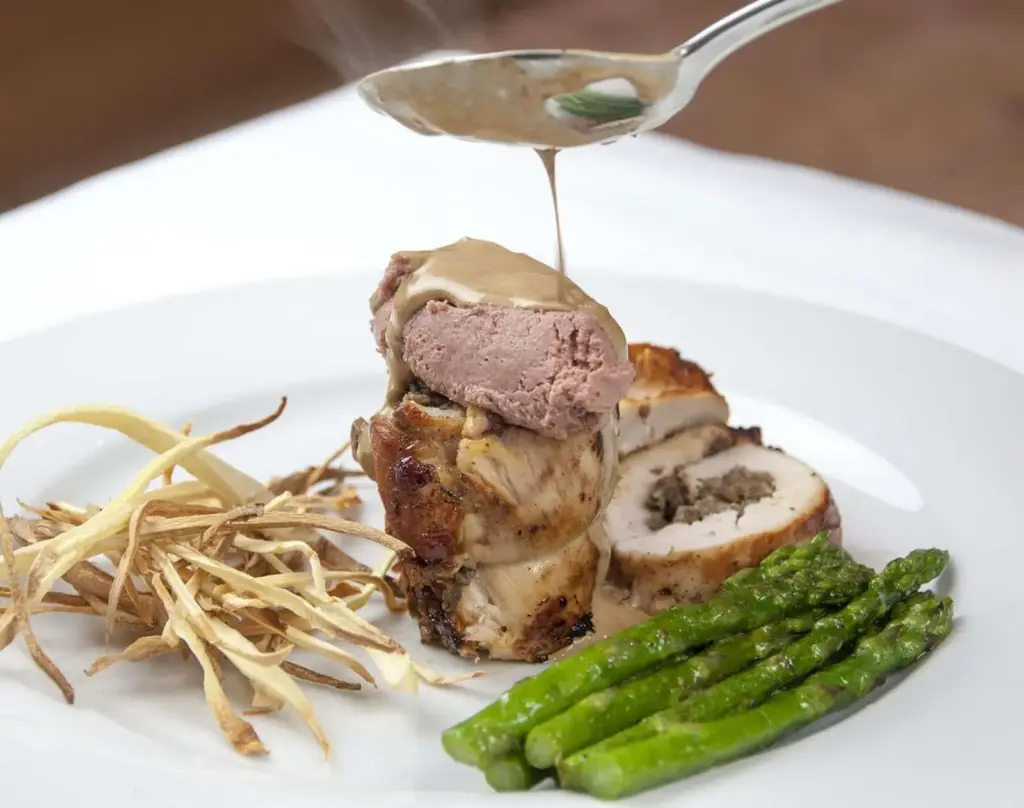 Succulent mushroom duxelle stuffed chicken breast. Pan-fried in a skillet and finished off in the oven. A wonderful, tasty and healthy chicken recipe. Yum! | theyumyumclub.com