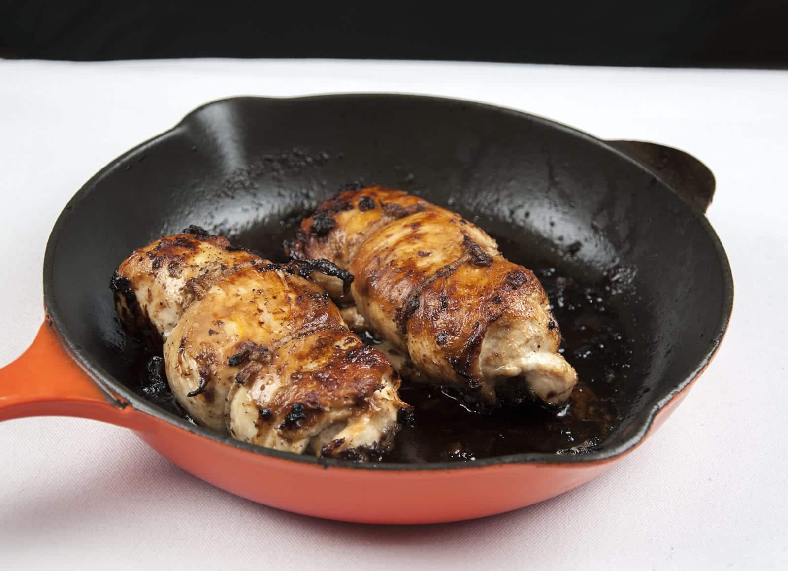 Succulent mushroom duxelle stuffed chicken breast. Pan-fried in a skillet and finished off in the oven. A wonderful, tasty and healthy chicken recipe. Yum! | theyumyumclub.com