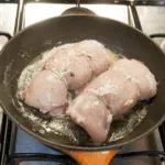 Succulent mushroom duxelle stuffed chicken breast. Pan-fried in a skillet and finished off in the oven. A wonderful, tasty and healthy chicken recipe. Yum! | theyumyumclub.com