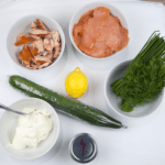 Just look at this individual smoked salmon terrine. I love this recipe. So tasty and a dish that will impress your friends at any dinner party. Hot and cold smoked salmon, cream cheese with chives, and even topped with a little caviar. Yum! | theyumyumclub.com