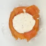Just look at this individual smoked salmon terrine. I love this recipe. So tasty and a dish that will impress your friends at any dinner party. Hot and cold smoked salmon, cream cheese with chives, and even topped with a little caviar. Yum! | theyumyumclub.com