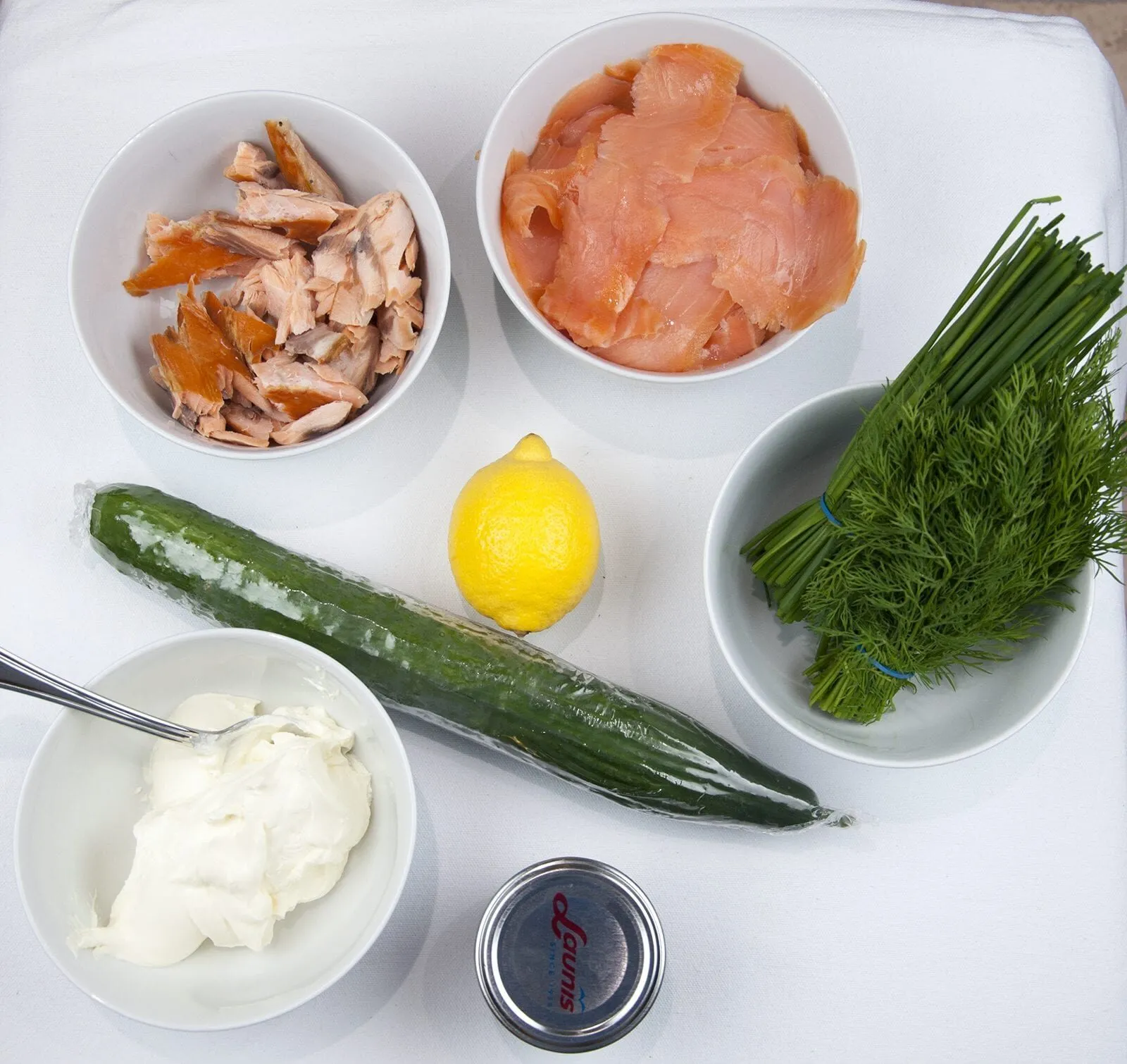 Just look at this individual smoked salmon terrine. I love this recipe. So tasty and a dish that will impress your friends at any dinner party. Hot and cold smoked salmon, cream cheese with chives, and even topped with a little caviar. Yum! | theyumyumclub.com