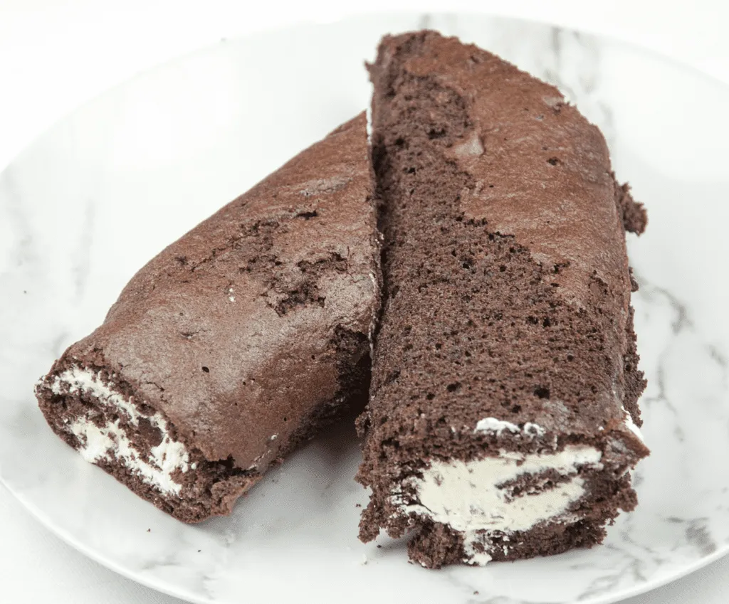 Christmas is here and it's time to start baking. How about a Yule Log? Festive chocolate bliss & the kids can help! I'll show you how with this easy recipe. | theyumyumclub.com