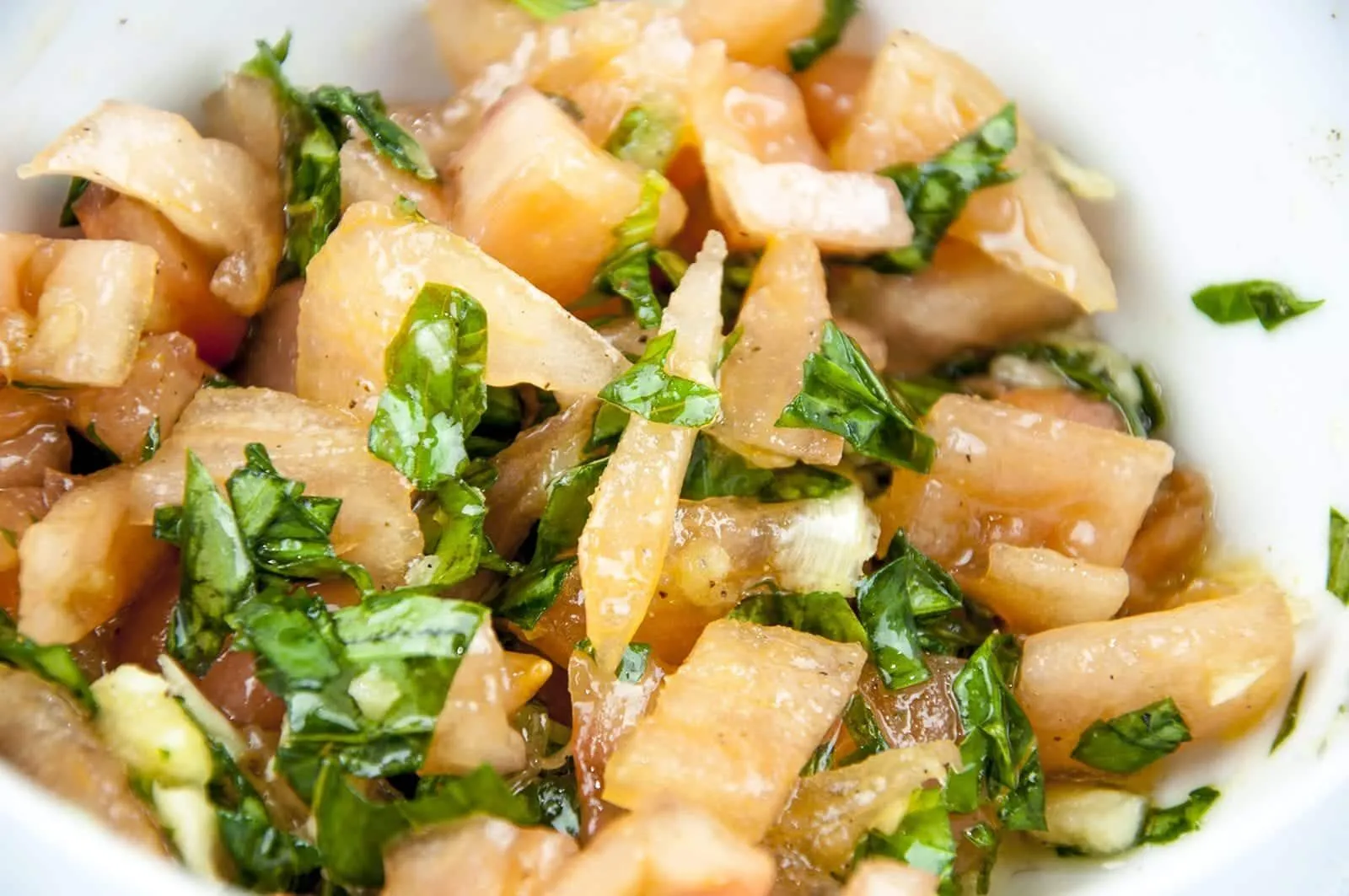 Enjoy the taste of Italy in this homemade bruschetta. Wonderful garlic, tomato concasse, basil, and extra virgin olive oil. Make the bread too if you like! | theyumyumclub.com