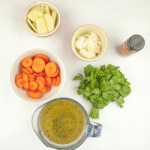 Carrot and coriander soup. A classic of a soup. Just 5 main ingredients! Carrot, coriander, potato, onion and vegetable stock. Suitable for vegetarians and vegans and only 156 calories per bowl! Yum! | theyumyumclub.com