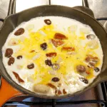 This creamy chicken gnocchi recipe brings the taste of Italy right to your own kitchen. Black olives. Sun-dried tomatoes. Baby spinach. Sounds good right? Yum! | theyumyumclub.com