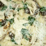 This creamy chicken gnocchi recipe brings the taste of Italy right to your own kitchen. Black olives. Sun-dried tomatoes. Baby spinach. Sounds good right? Yum! | theyumyumclub.com