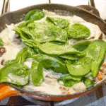 This creamy chicken gnocchi recipe brings the taste of Italy right to your own kitchen. Black olives. Sun-dried tomatoes. Baby spinach. Sounds good right? Yum! | theyumyumclub.com