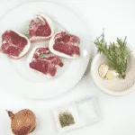Look at these wonderfully succulent slow roasted lamb chops. Mouth-watering lamb cooked with garlic and rosemary. A midweek extravagance but why not eh? Go on, treat yourself. Yum! | theyumyumclub.com