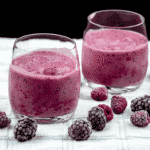 This blackberry and raspberry smoothie is a very tasty and healthy smoothie. Just 4 ingredients. Blackberries, raspberries, milk, and vanilla essence. It takes no time to make and at 130 calories a serving you can't go wrong! Yum! | theyumyumclub.com