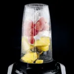 Watermelon and pineapple smoothie! So tasty and just 4 ingredients! Watermelon, pineapple, Greek yoghurt, and ice. 1% fat and less than 200 calories! Yum! | theyumyumclub.com
