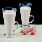 Watermelon and pineapple smoothie! So tasty and just 4 ingredients! Watermelon, pineapple, Greek yoghurt, and ice. 1% fat and less than 200 calories! Yum! | theyumyumclub.com
