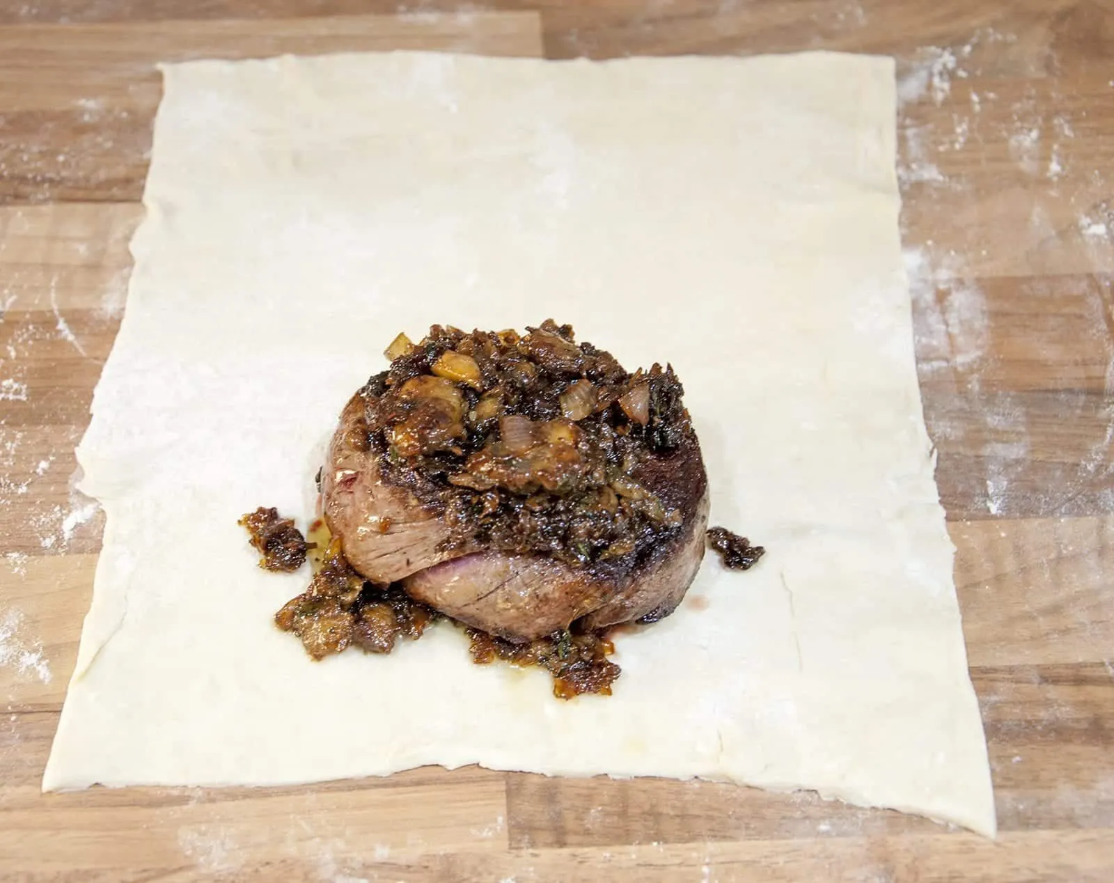 This individual beef wellington recipe is a yummy treat for one or more. Beef tenderloin, rich duxelle, and flakey puff pastry. Decadence at is best ???? | theyumyumclub.com