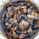 Classic coq au vin. A wonderfully rustic French casserole of chicken in red wine. Simple to make and very tasty. A great recipe for all of the family. Yum! | theyumyumclub.com