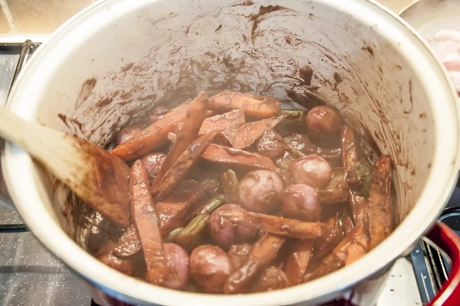 Classic coq au vin. A wonderfully rustic French casserole of chicken in red wine. Simple to make and very tasty. A great recipe for all of the family. Yum! | theyumyumclub.com