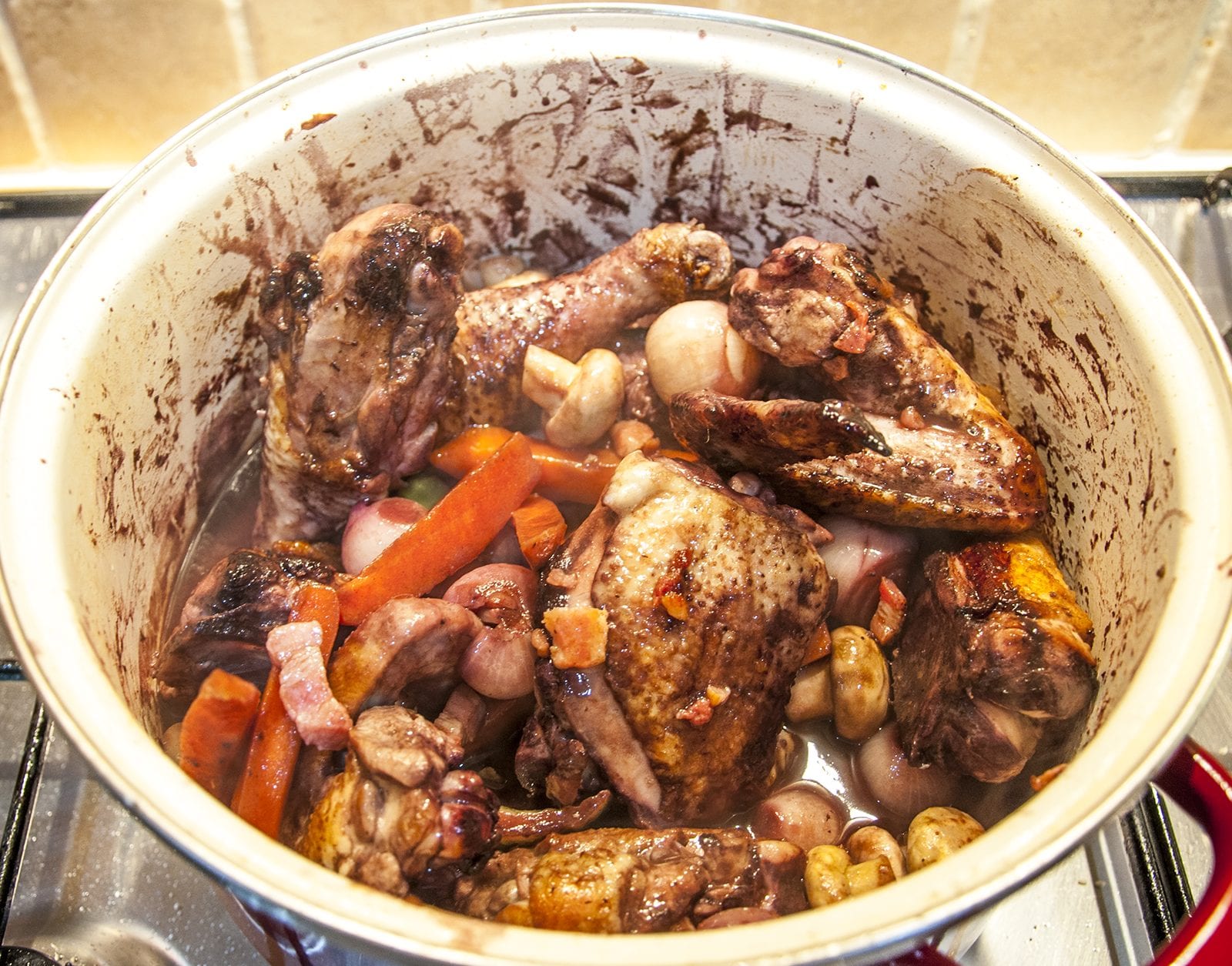 Classic coq au vin. A wonderfully rustic French casserole of chicken in red wine. Simple to make and very tasty. A great recipe for all of the family. Yum! | theyumyumclub.com