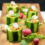 Cucumber potted shrimp. Serve as a delicious appetizer for your dinner party or as a simple nibble as your guests arrive. Shrimp, garlic and chilli all served in fresh cucumber. Yum! | theyumyumclub.com