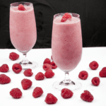 Raspberry and pineapple smoothie, with a little surprise! Banana to add texture and a wonderful hint of cinnamon to taste. A great start to the day. Yum! | theyumyumclub.com