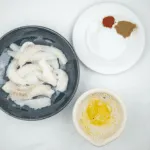 Spicy codfish tacos. How tasty do these sound? Fresh cod fish smothered in cumin and paprika wrapped in a tortilla with red onion, lime and coriander. Yum! | theyumyumclub.com