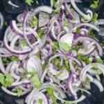 Spicy codfish tacos. How tasty do these sound? Fresh cod fish smothered in cumin and paprika wrapped in a tortilla with red onion, lime and coriander. Yum! | theyumyumclub.com