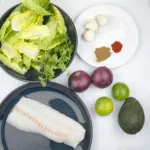 Spicy codfish tacos. How tasty do these sound? Fresh cod fish smothered in cumin and paprika wrapped in a tortilla with red onion, lime and coriander. Yum! | theyumyumclub.com