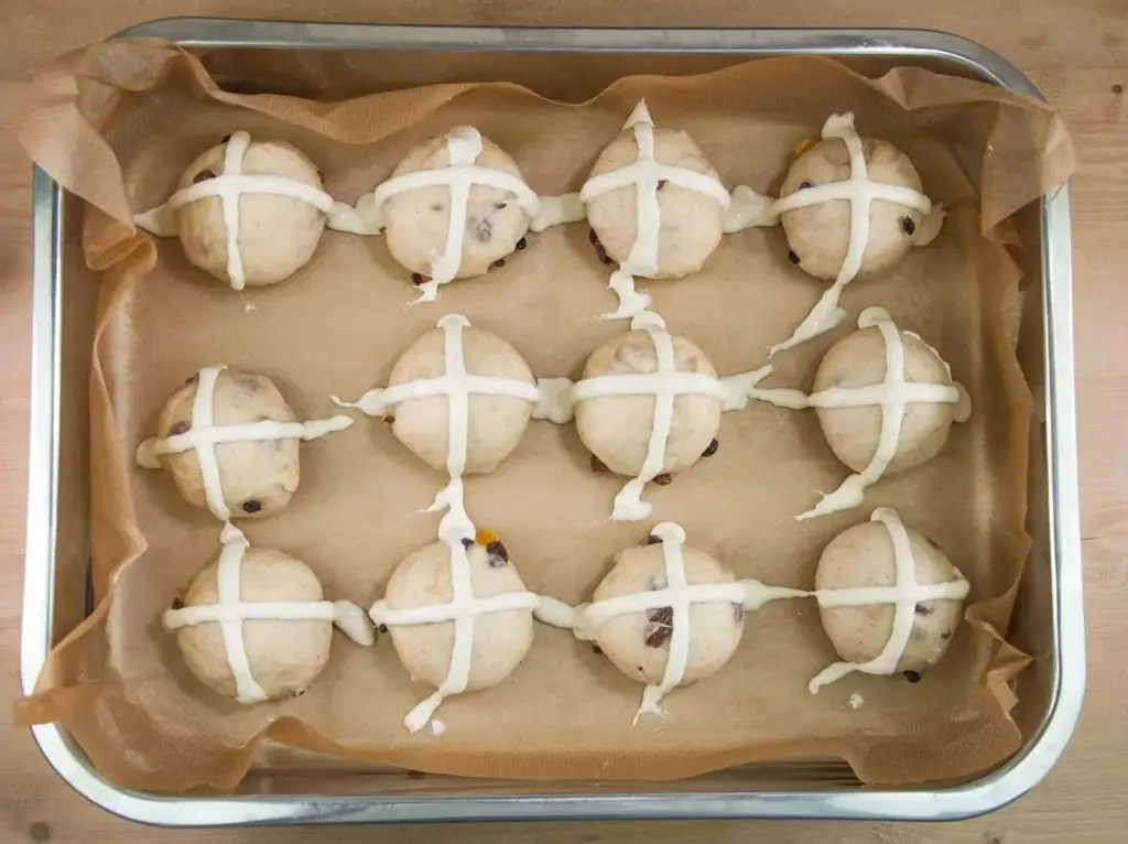 It's Easter so hot cross buns are on the menu!! What a joyous moment. Homemade hot cross buns. Simple to make and so delicious. Yum! Yum! | theyumyumclub.com